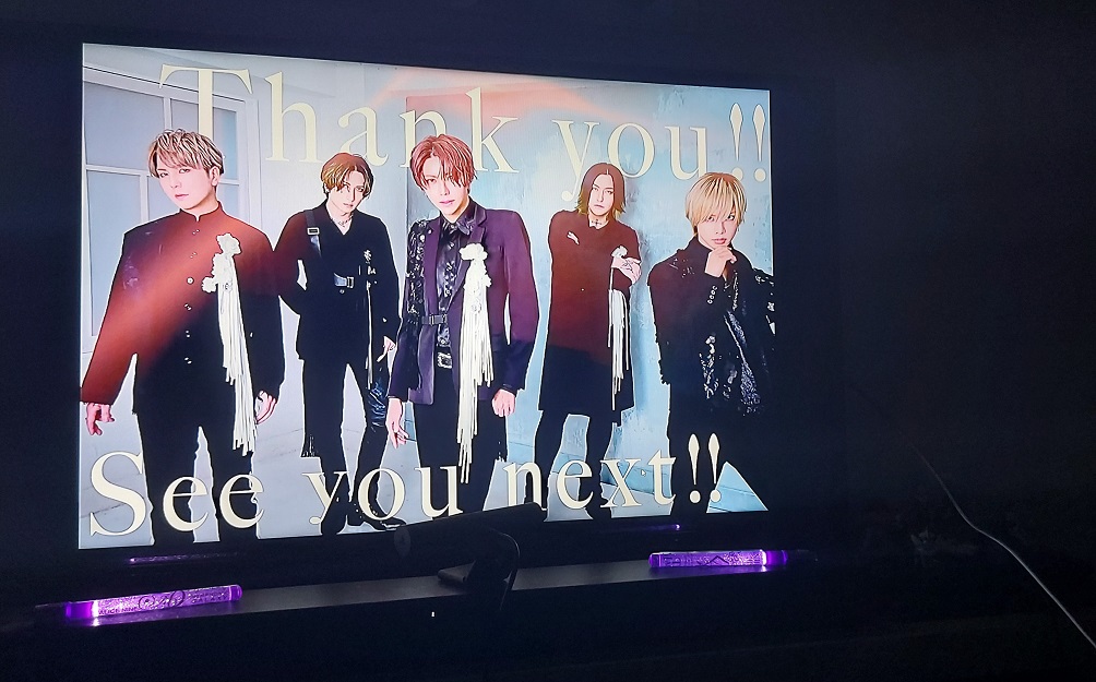 On a TV screen is a photo of all five members of ALICE NINE. with the text "Thank you!! See you next!!" framing them. Below the TV, two purple galaxy lights are lit as decoration.