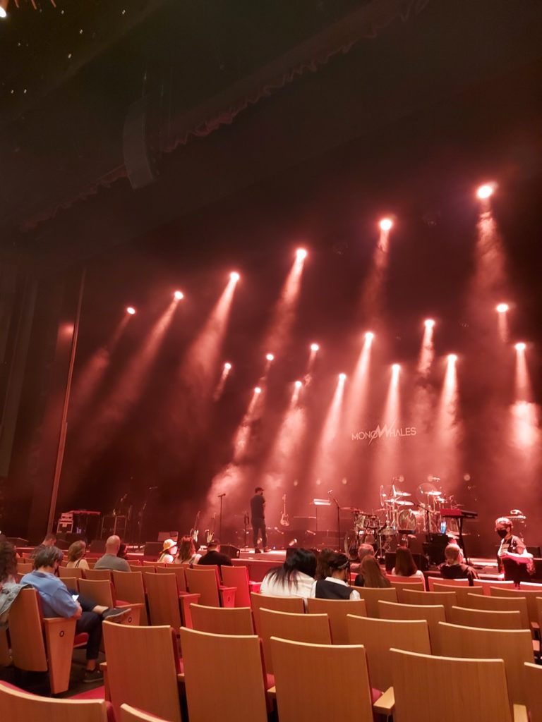 View of a stage lit up in red stage lights.